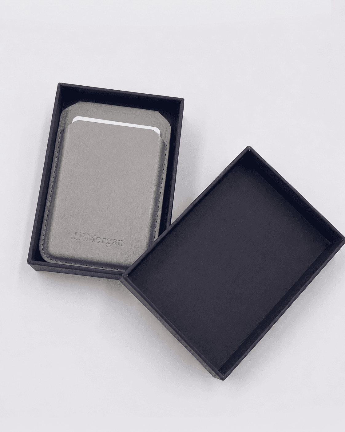 A grey J.P.Morgan card holder in a dark presentation box