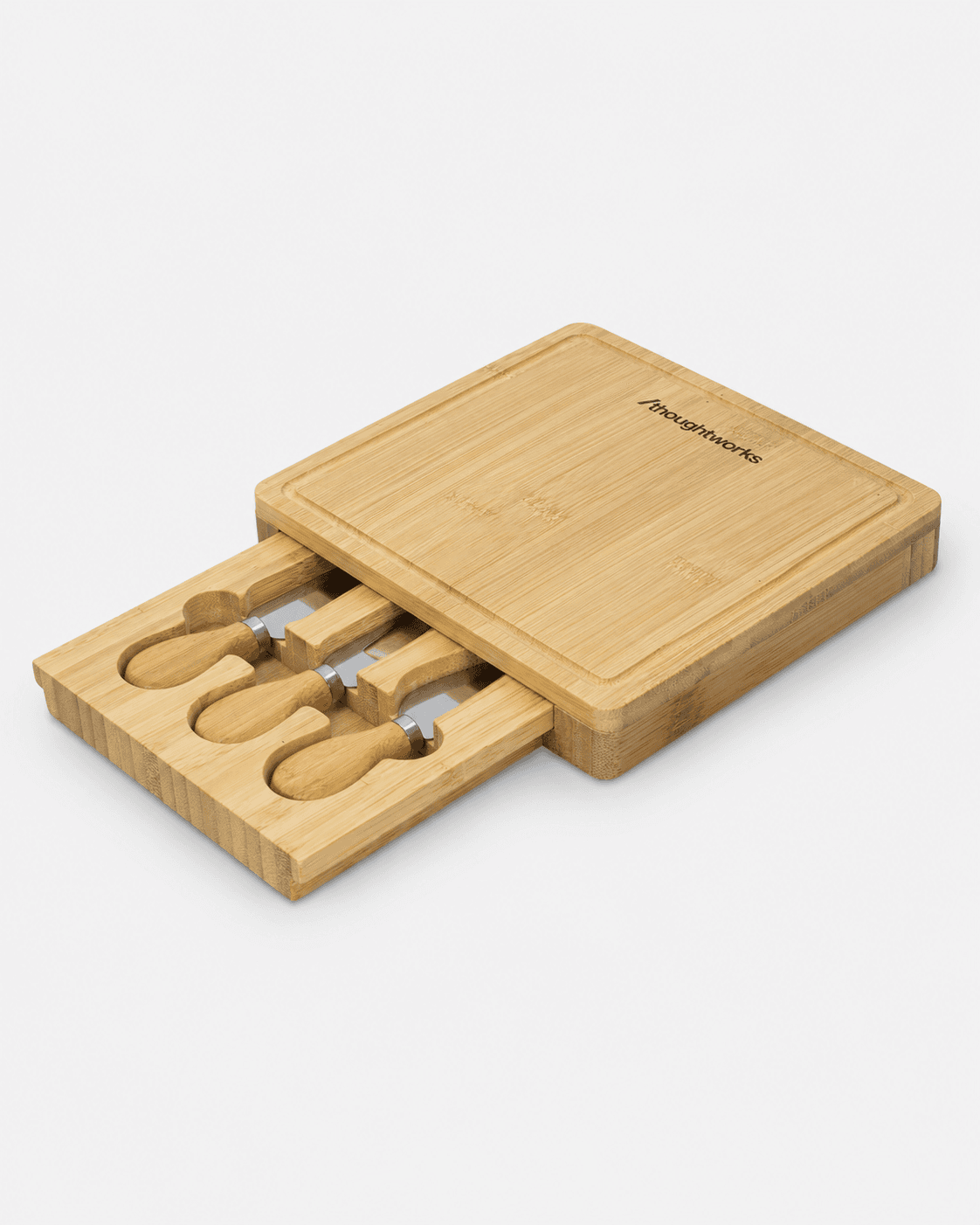 Thoughtworks branded bamboo board with serving tools